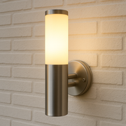 Wall-mounted outdoor light fixture on a brick wall