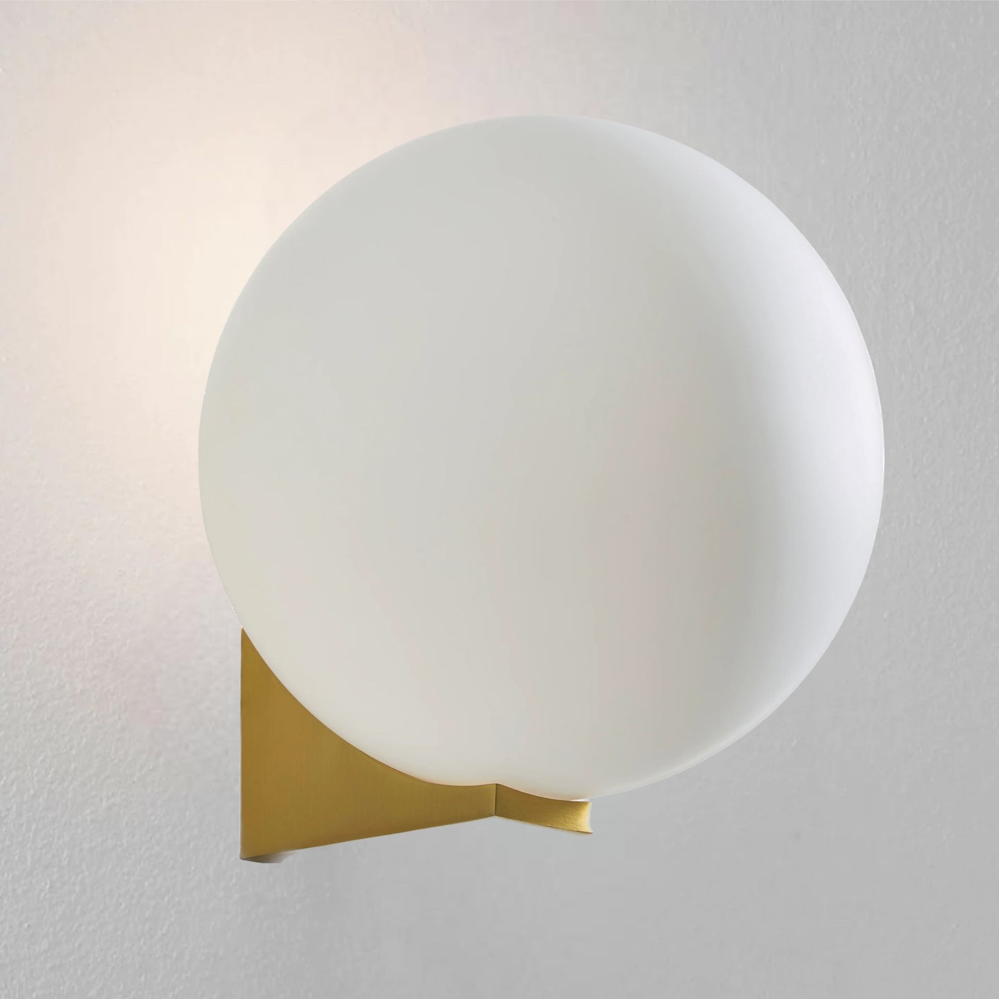Our Jasper satin brass wall light with white opal glass diffuser adds a touch of opulence and luxury to the walls of your home. The modern light fitting would look perfect installed next to a mirror, on corridors or hallways, bedside and living rooms, this light also has IP44 protection making it suitable for all bathrooms.