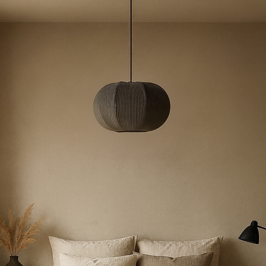 Cozy bedroom with a bed, nightstands, and pendant light.