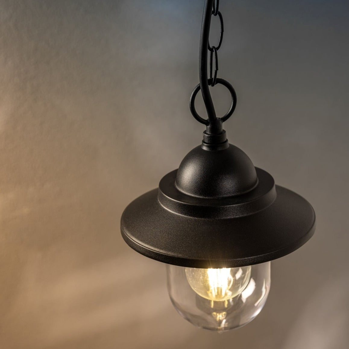 Our Ryder lantern delivers on style and durability and is a smart choice for your exterior lighting. With its black powder coated aluminium construction teamed with clear polycarbonate diffuser, this lantern is hardwearing and rust and weatherproof. Built for life outdoors, it has an IP44 rating which means it can withstand the harshest of weather conditions. For sophisticated yet robust outdoor lighting, our Ryder black outdoor traditional lantern is a strong contender.