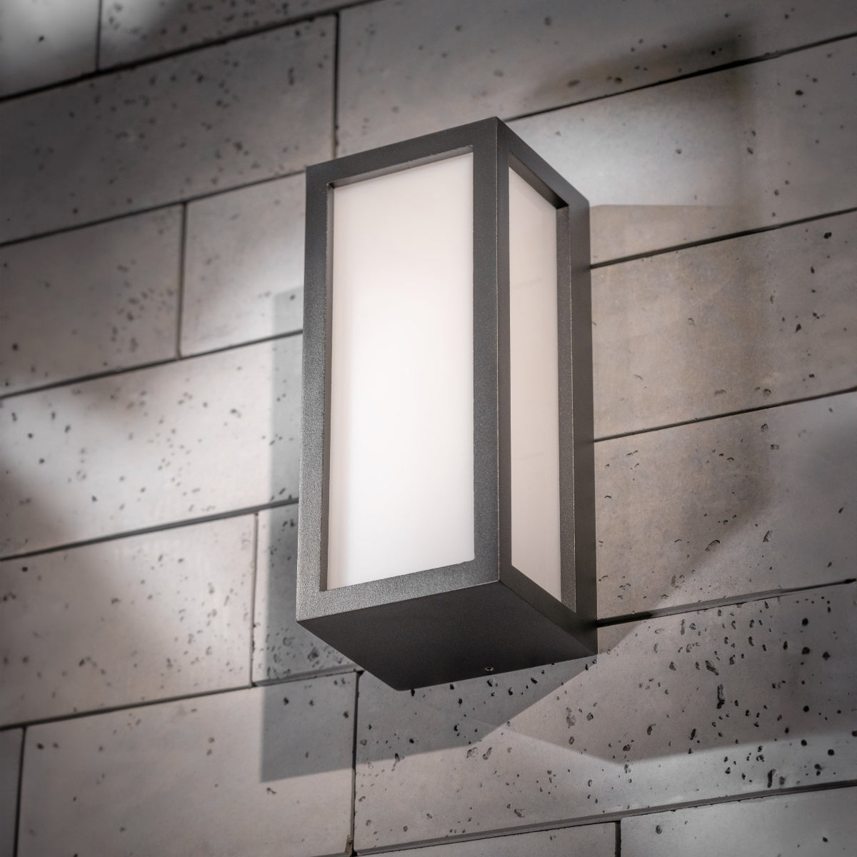 If you’re looking for a modern take on a traditional outdoor wall light, this black aluminium rectangle wall light is perfect for adding style and protection for your home. This classic design with a contemporary twist, styled with a metal rectangle shape and fitted with opal diffusers also contains an imposing black finish