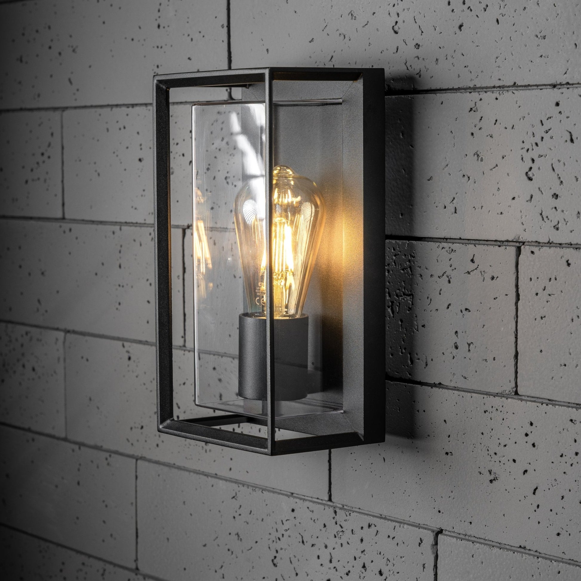 Our Floriana black aluminium outdoor wall mounted lantern outdoor light with clear polycarbonate diffusers would look perfect in a modern or more traditional home design.