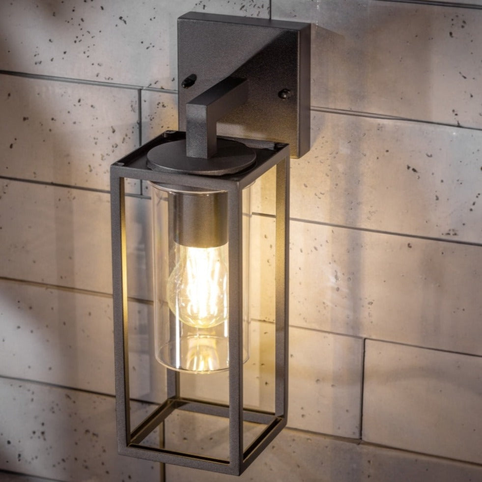 If you’re looking for a modern take on a traditional outdoor wall light, this black lantern wall light with clear diffuser is perfect for adding style and protection for your home. This classic design with a contemporary twist, styled with a metal lantern shape and fitted with a cylinder diffuser that allows the light to shine effectively.