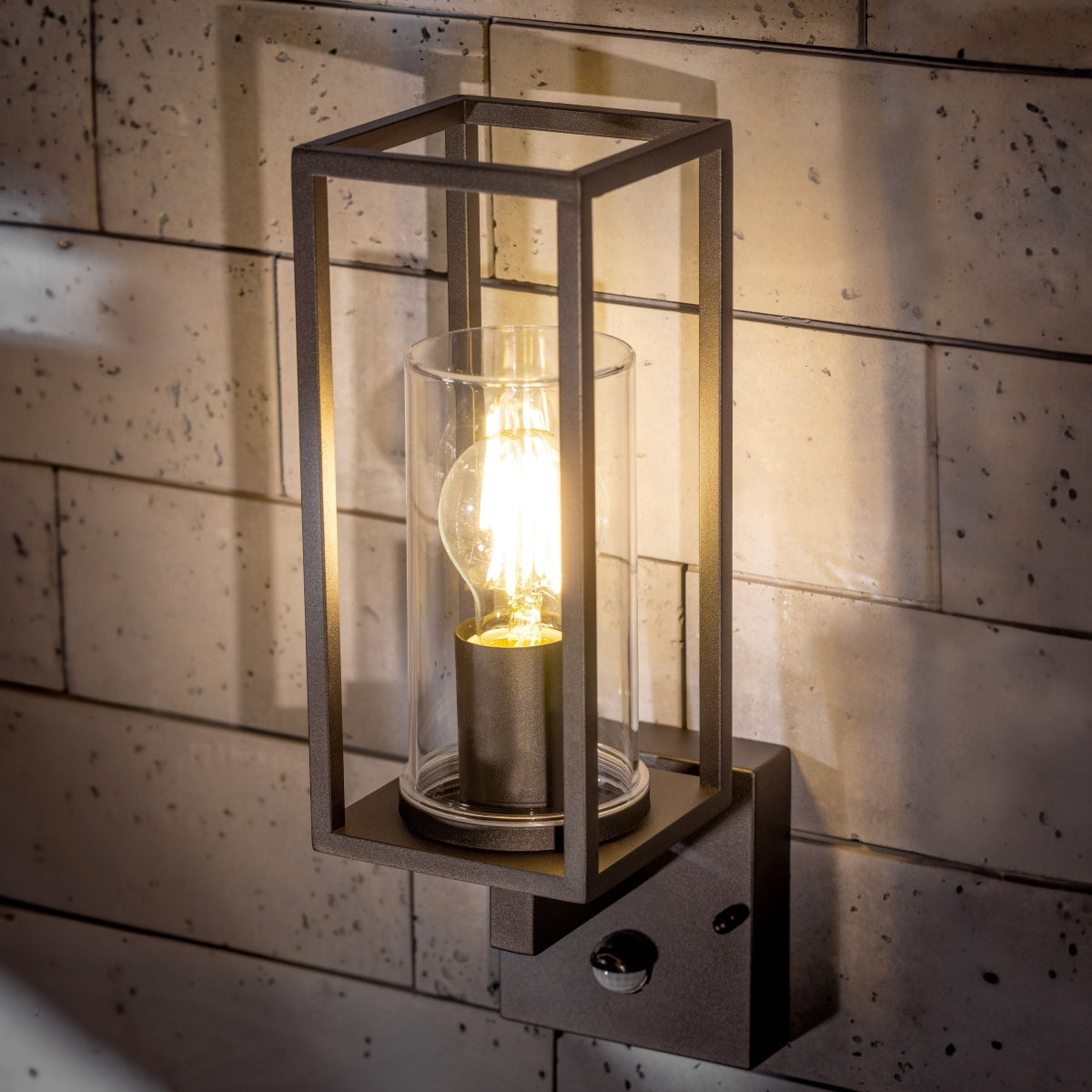 If you’re looking for a modern take on a traditional outdoor wall light, this black lantern wall light with clear diffuser is perfect for adding style and protection for your home. This classic design with a contemporary twist, styled with a metal lantern shape and fitted with a cylinder diffuser that allows the light to shine effectively