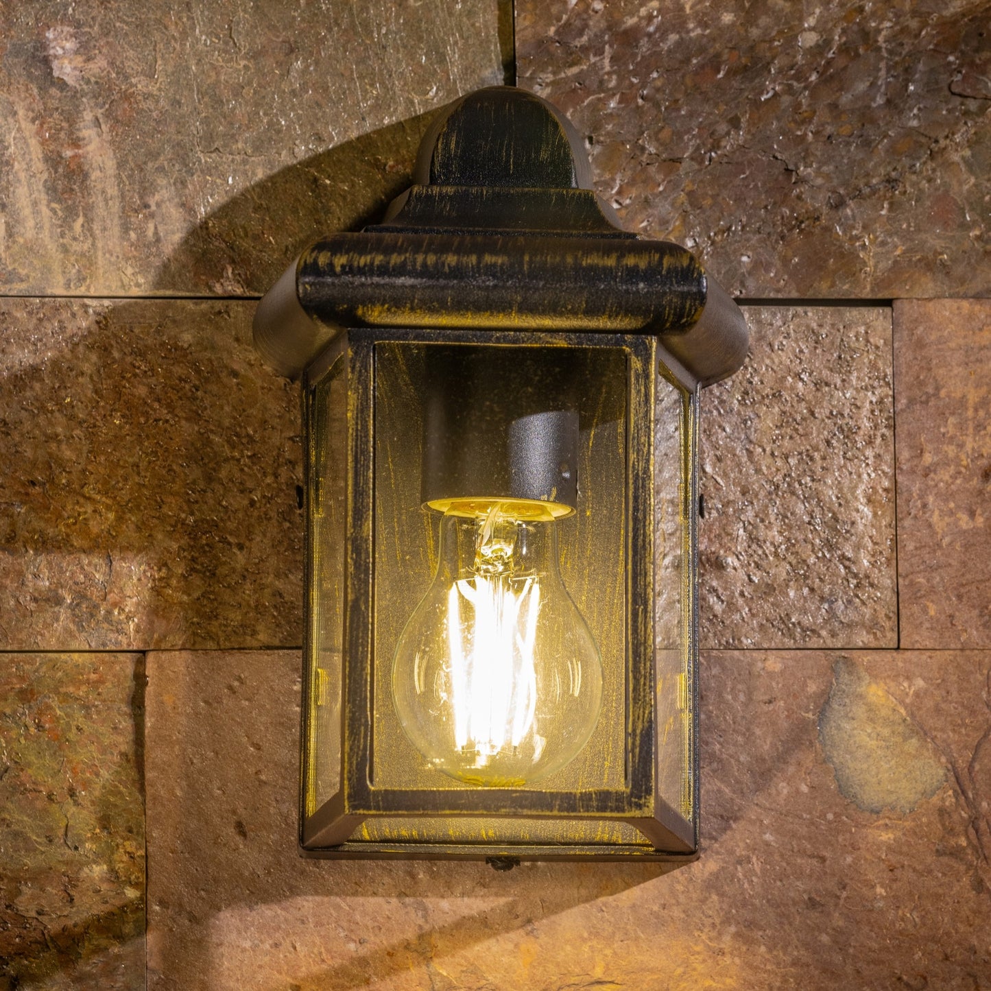 Our Camila wall lantern light is styled with a sophisticated black and bronze colour scheme, allowing the wall light to fit into any home’s style. What’s more, the lantern’s design is a modern take on a traditional styled wall light, creating a flexible look for interior and exterior use. 