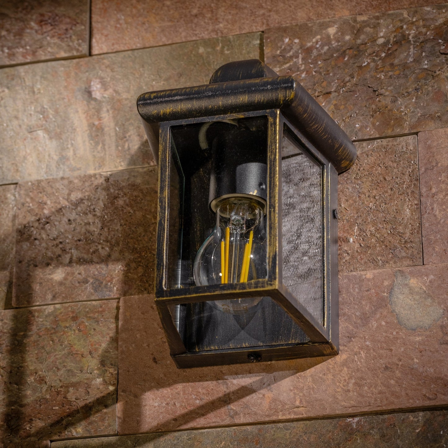 Our Camila wall lantern light is styled with a sophisticated black and bronze colour scheme, allowing the wall light to fit into any home’s style. What’s more, the lantern’s design is a modern take on a traditional styled wall light, creating a flexible look for interior and exterior use. 