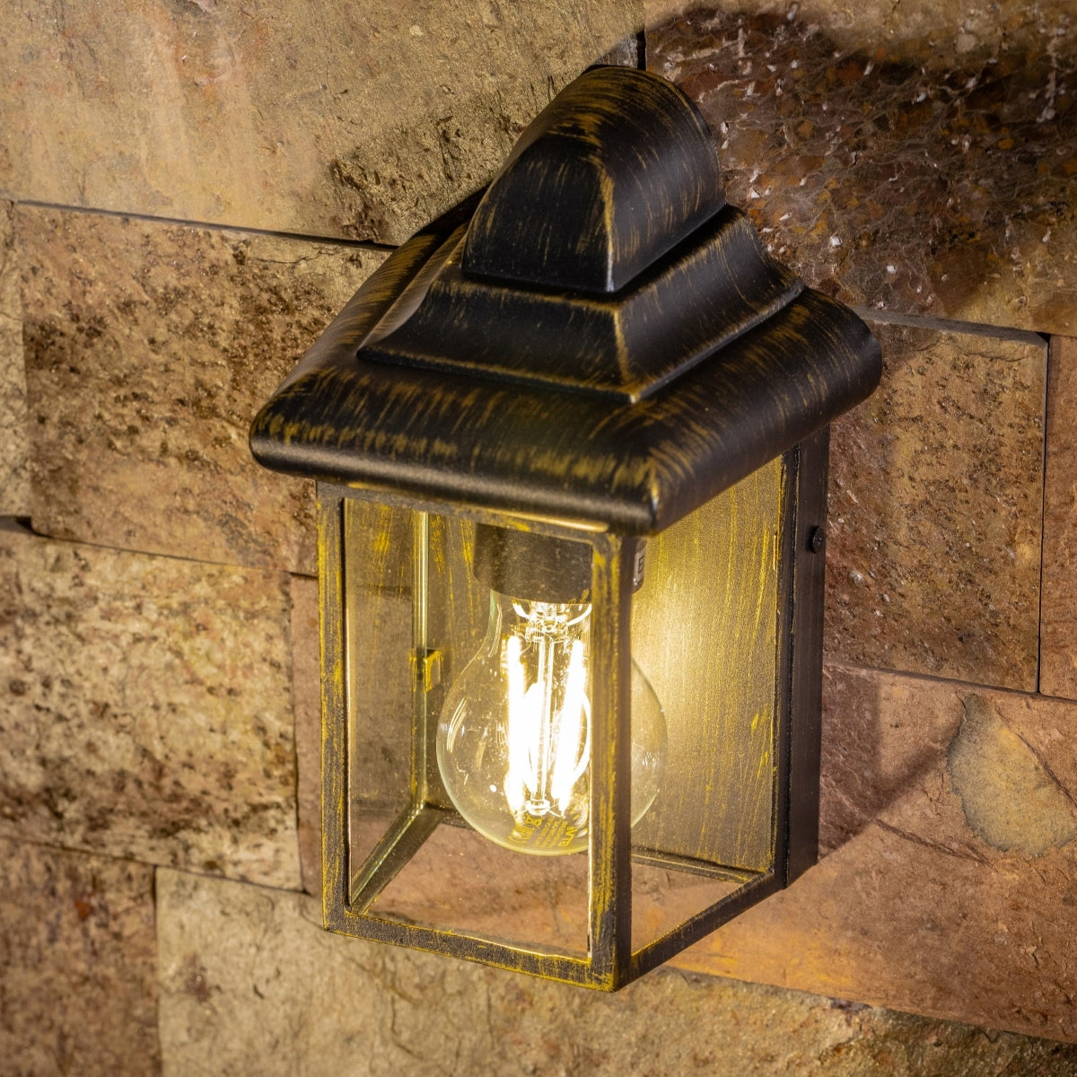 Our Camila wall lantern light is styled with a sophisticated black and bronze colour scheme, allowing the wall light to fit into any home’s style. What’s more, the lantern’s design is a modern take on a traditional styled wall light, creating a flexible look for interior and exterior use. 