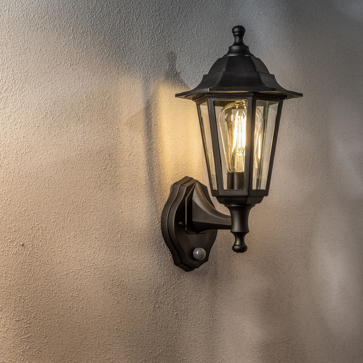 Our Yasmin lantern delivers on style and durability and is a smart choice for your exterior lighting. With its black polycarbonate construction teamed with clear polycarbonate panes and built in motion sensor, this lantern is hardwearing and rust and weatherproof. Built for life outdoors, it has an IP44 rating which means it can withstand the harshest of weather conditions.