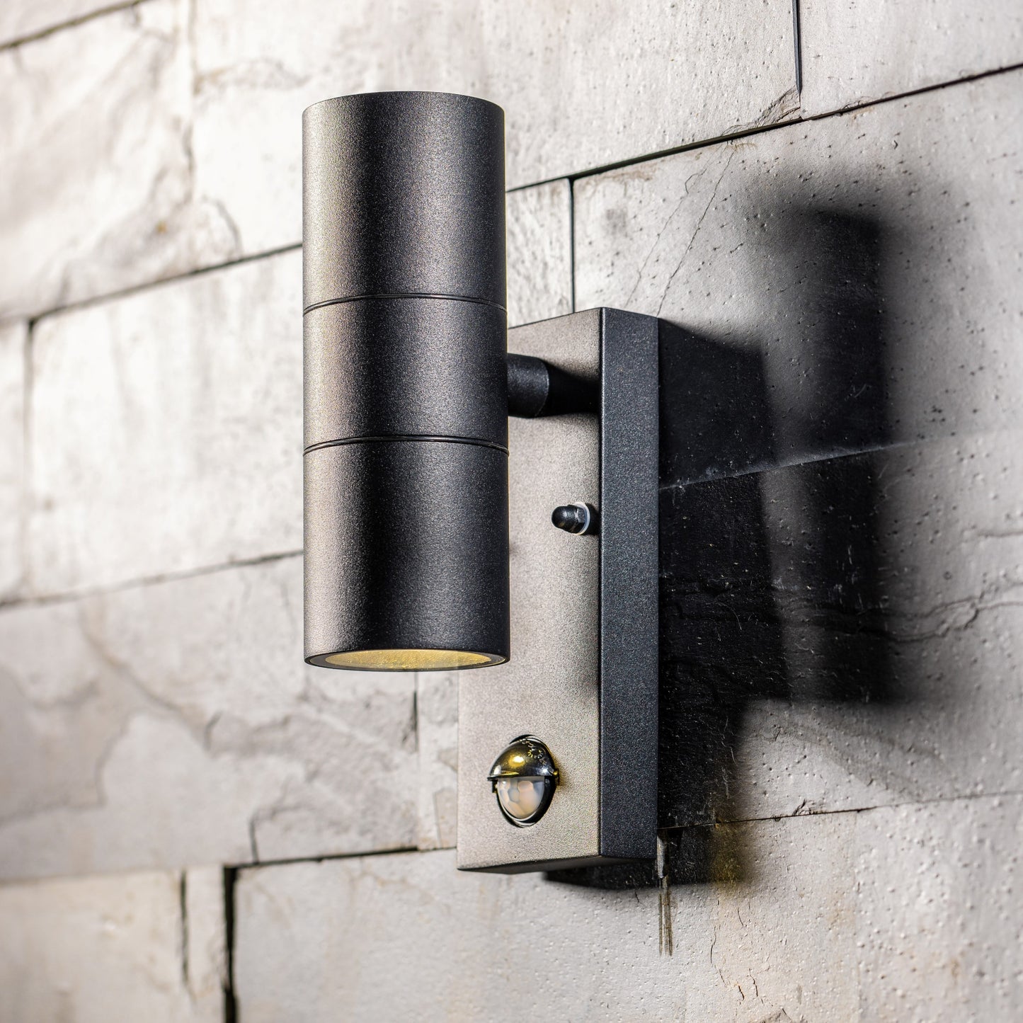 Our Leon outdoor single down light is modern and stylish in its appearance. It comes in a cylinder design mounted on a rectangle back plate complete with clear glass diffuser and built in PIR motion sensor. It is designed for durability and longevity with its robust material producing a fully weatherproof and water resistant light fitting