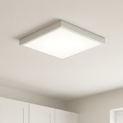 Square ceiling light fixture in a room with white walls and ceiling. Porch light