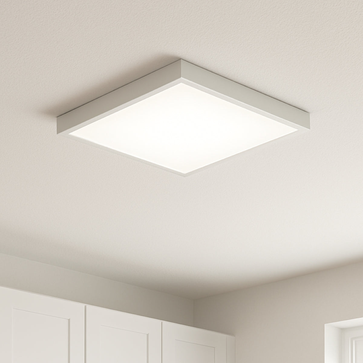 Square ceiling light fixture in a room with white walls and ceiling. Porch light
