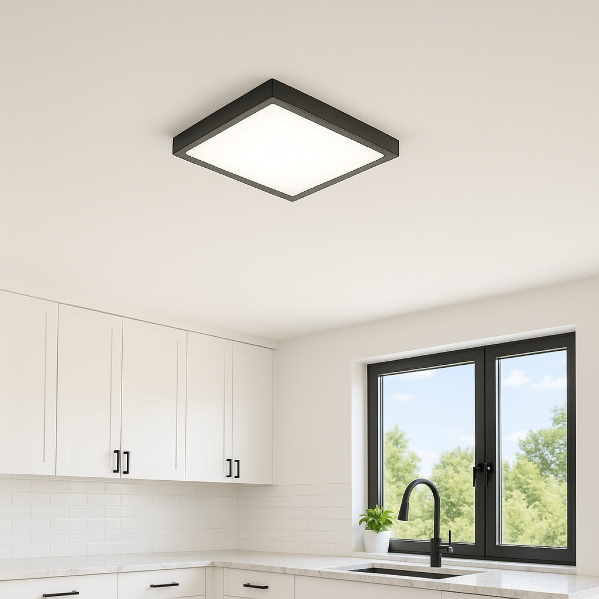 Modern kitchen with a ceiling light fixture, white cabinets, and a window.