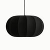 Black pendant lamp with a ribbed texture on a white background