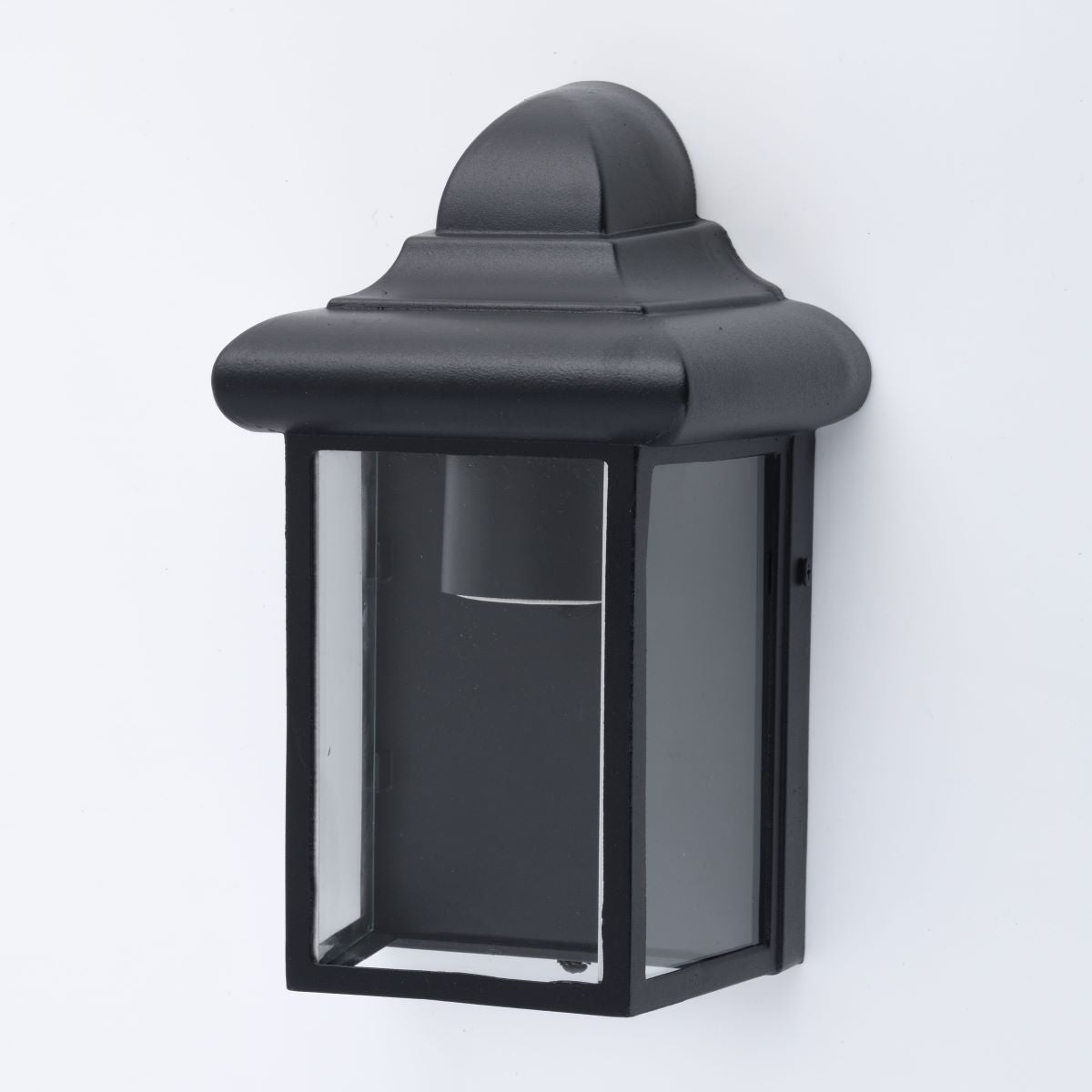 Our Camila wall lantern light is styled with a sophisticated black colour scheme, allowing the wall light to fit into any home’s style. What’s more, the lantern’s design is a modern take on a traditional styled wall light, creating a flexible look for interior and exterior use.