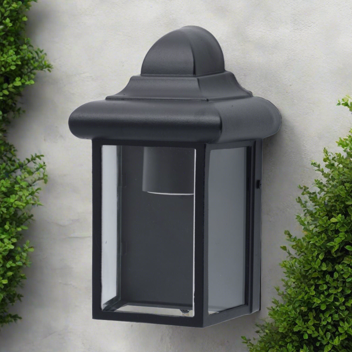 Our Camila wall lantern light is styled with a sophisticated black colour scheme, allowing the wall light to fit into any home’s style. What’s more, the lantern’s design is a modern take on a traditional styled wall light, creating a flexible look for interior and exterior use.