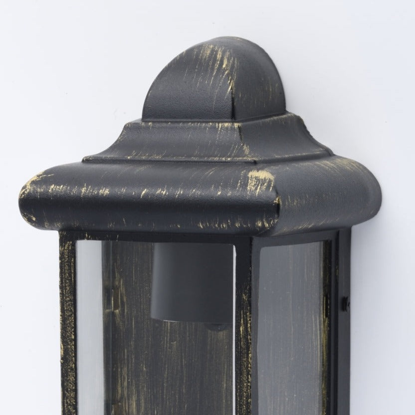 Our Camila wall lantern light is styled with a sophisticated black and bronze colour scheme, allowing the wall light to fit into any home’s style. What’s more, the lantern’s design is a modern take on a traditional styled wall light, creating a flexible look for interior and exterior use. 