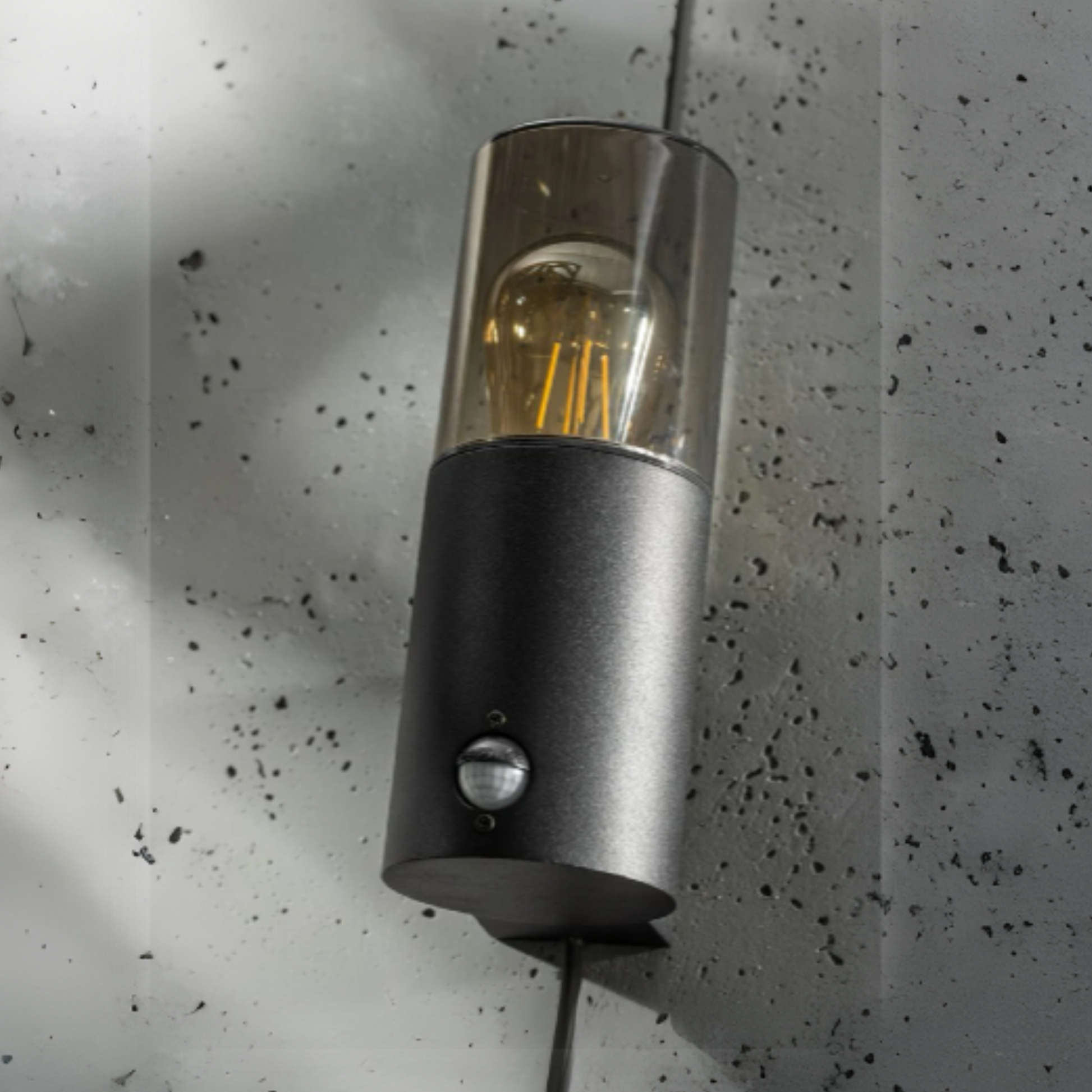 Explore our black cylinder wall light today, fit with a smoky diffuser and motion sensor features! If you require a valuable lighting system and an additional layer of security for your home’s outdoor space, then this lighting body can provide the right protection and style for you.