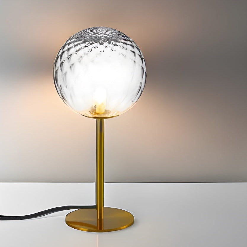 Introducing our Dixon table lamp with its elegant crystal and golden finish it will be sure to make a stylish addition to any living space. It features an ornate cut glass crystal globe design and is complimented by a brushed gold base that gives the light an undeniably luxurious style.
