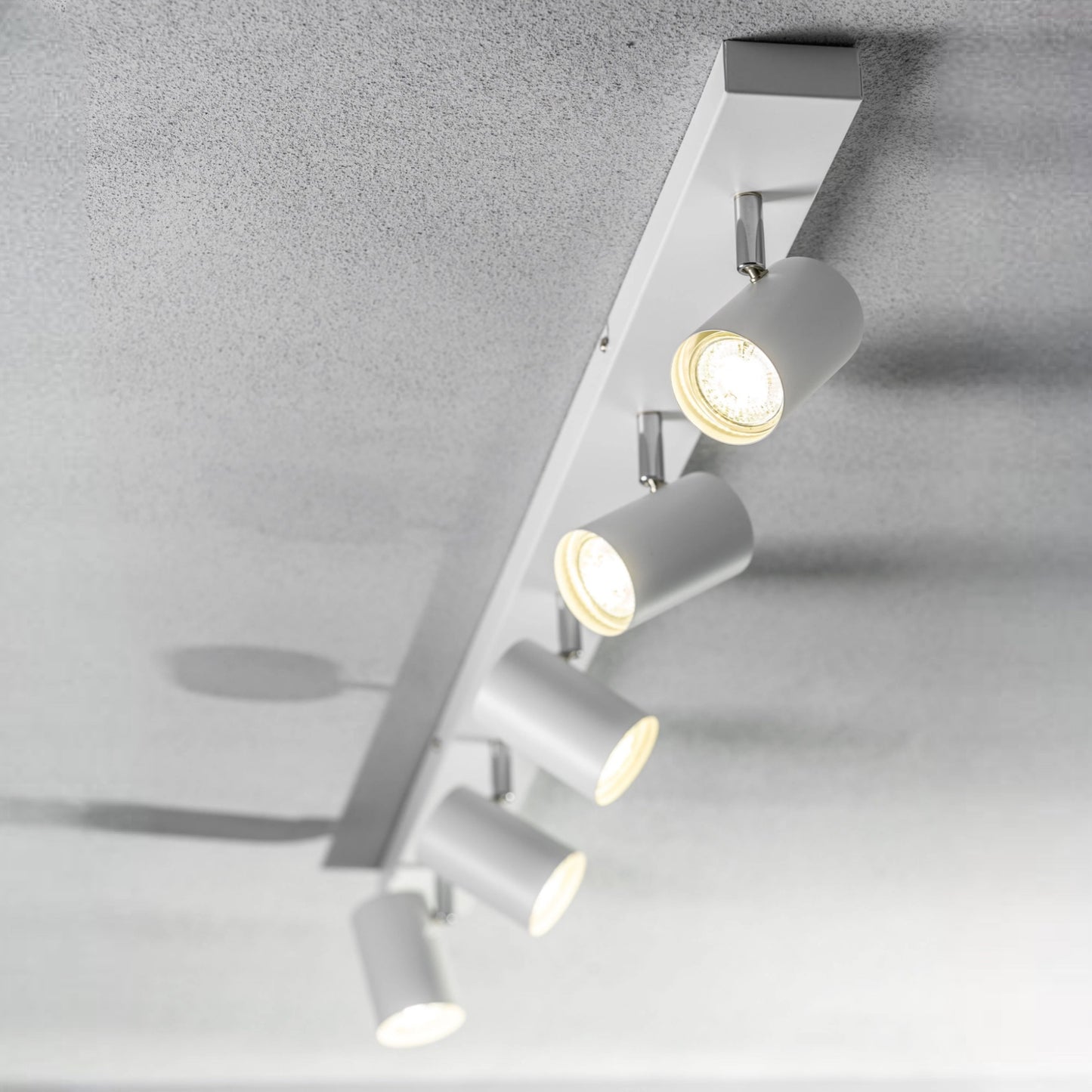 Add an industrial style to your home with the VENETO spotlight light finished in white. The lamp is also ideal for task lighting due to the adjustable heads providing a focused beam. The simplistic design of this light fitting makes it suitable for all interior styles.