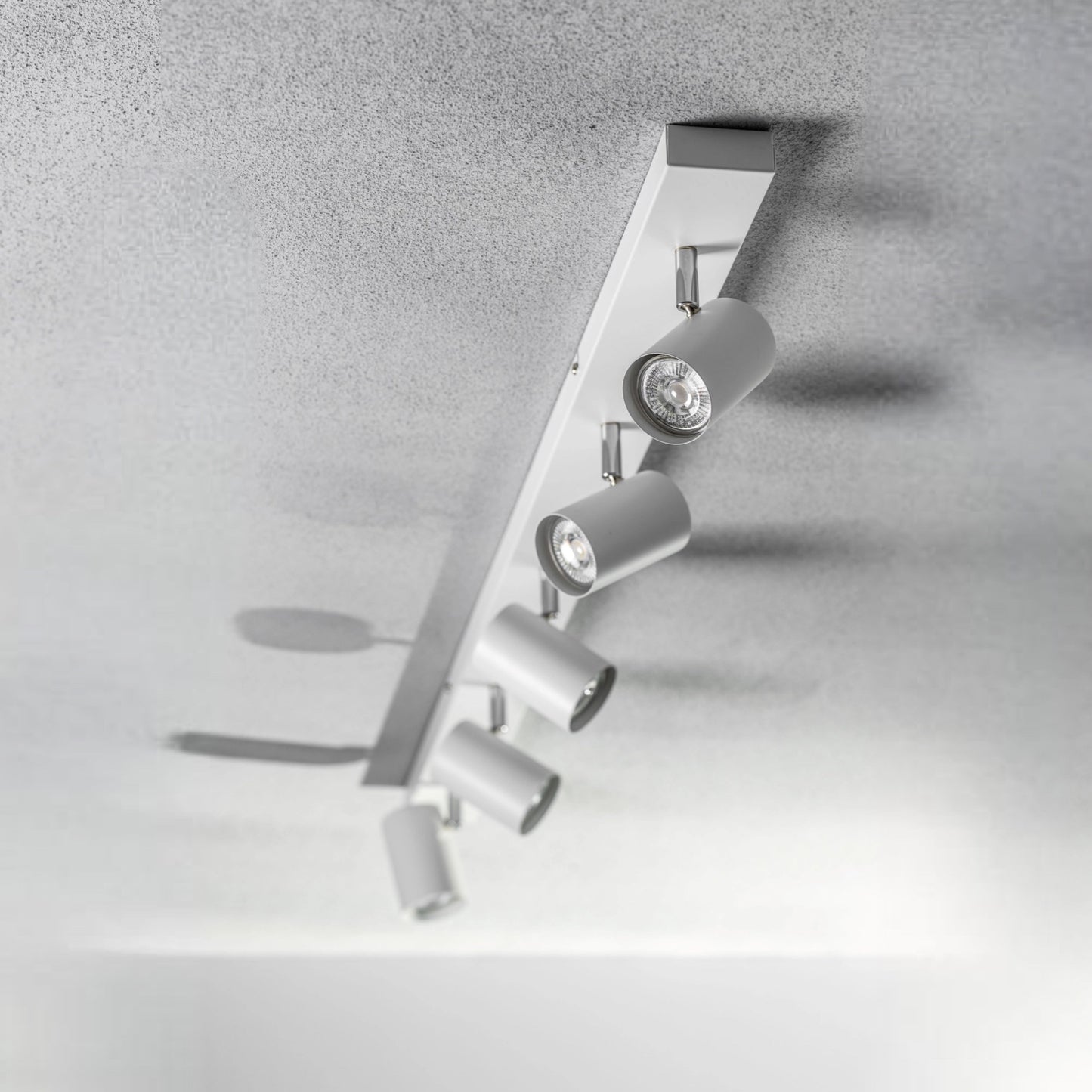 Add an industrial style to your home with the VENETO spotlight light finished in white. The lamp is also ideal for task lighting due to the adjustable heads providing a focused beam. The simplistic design of this light fitting makes it suitable for all interior styles.