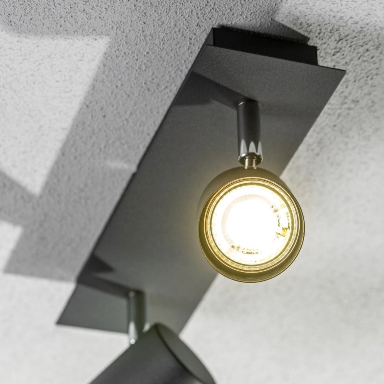 Add an industrial style to your home with the VENETO spotlight light finished in white. The lamp is also ideal for task lighting due to the adjustable heads providing a focused beam. The simplistic design of this light fitting makes it suitable for all interior styles.