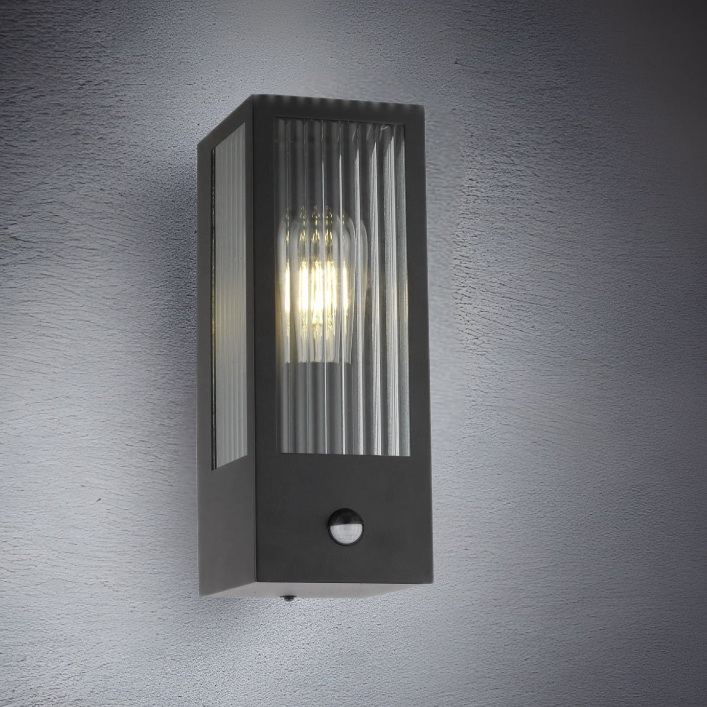 If you’re looking for a modern take on a traditional outdoor wall light, this modern bevelled glass rectangle wall light is perfect for adding style and protection for your home. This classic wall light is designed with a contemporary twist, styled with a rectangle shape and fitted with glass bevelled windows that allow the light to shine effectively. Integrated PIR Motion Sensor.