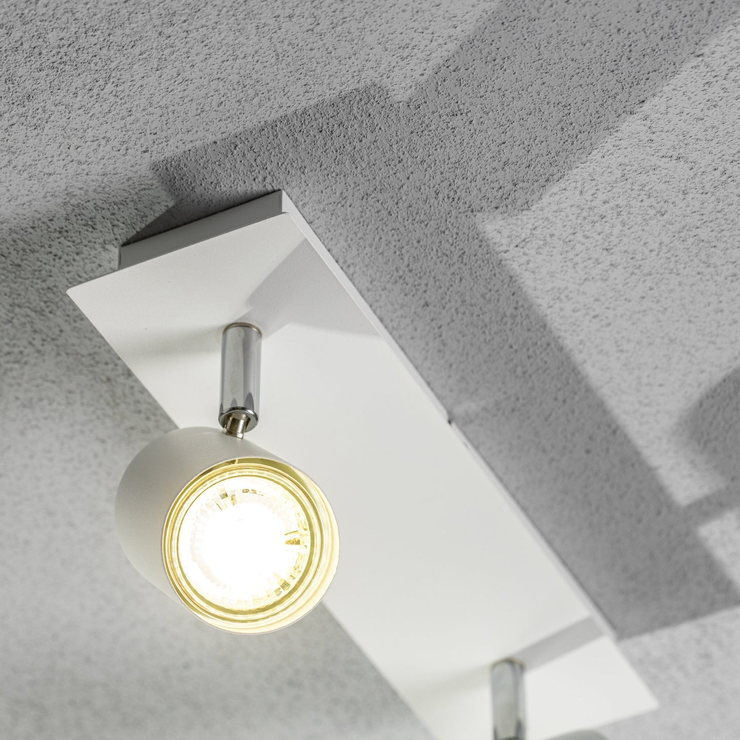 Add an industrial style to your home with the VENETO spotlight light finished in white. The lamp is also ideal for task lighting due to the adjustable heads providing a focused beam. The simplistic design of this light fitting makes it suitable for all interior styles.