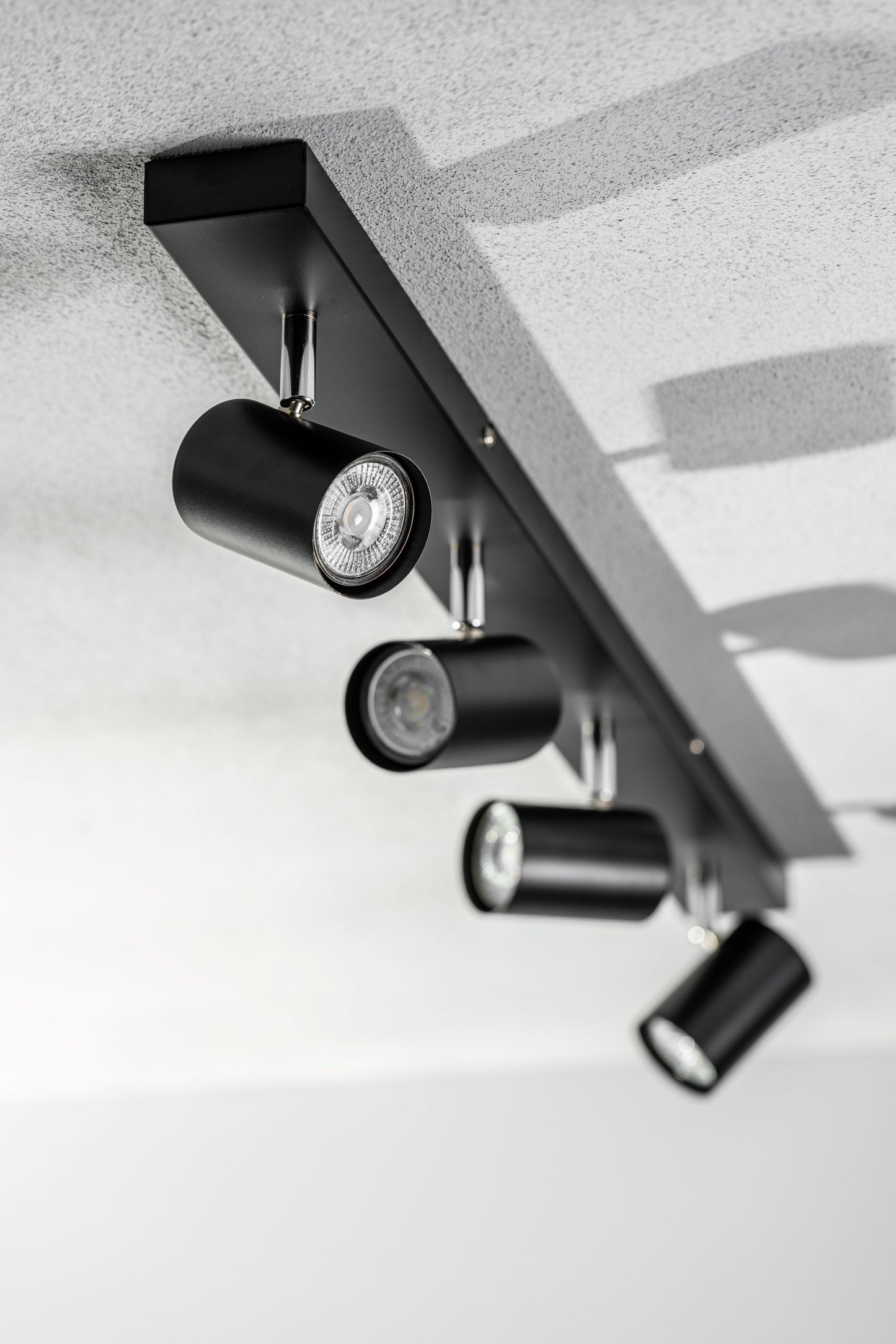 Add an industrial style to your home with the VENETO spotlight light finished in white. The lamp is also ideal for task lighting due to the adjustable heads providing a focused beam. The simplistic design of this light fitting makes it suitable for all interior styles.
