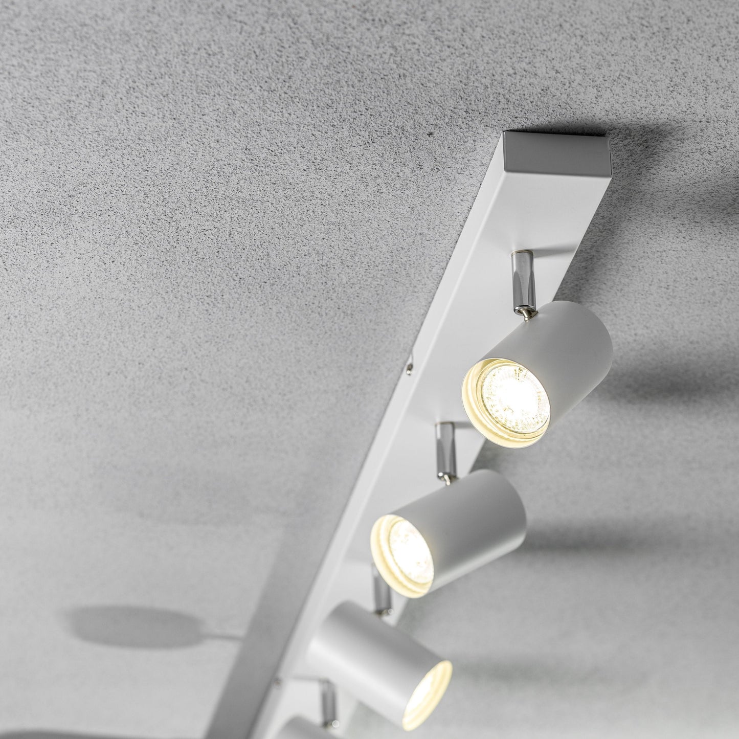 Add an industrial style to your home with the VENETO spotlight light finished in white. The lamp is also ideal for task lighting due to the adjustable heads providing a focused beam. The simplistic design of this light fitting makes it suitable for all interior styles.