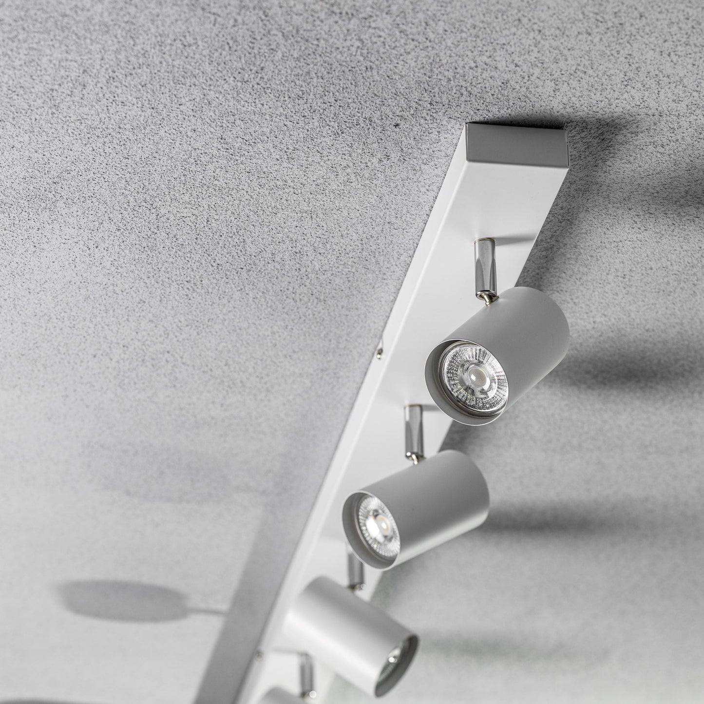 Add an industrial style to your home with the VENETO spotlight light finished in white. The lamp is also ideal for task lighting due to the adjustable heads providing a focused beam. The simplistic design of this light fitting makes it suitable for all interior styles.