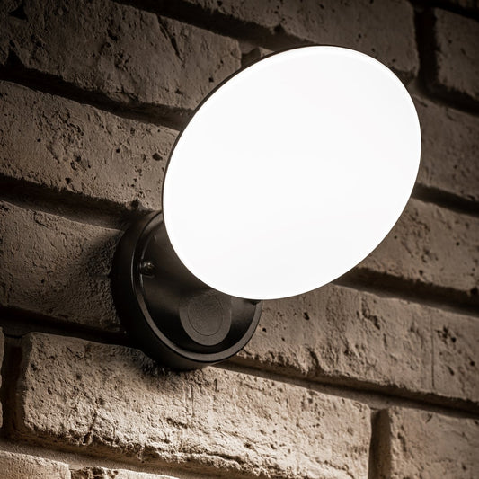 Our EZRA black plastic ABS plastic outdoor wall mounted round outdoor light with built in LED's would look perfect in a modern or more traditional home design. It is designed for durability and longevity with its robust material producing a fully weatherproof and water resistant light fitting.