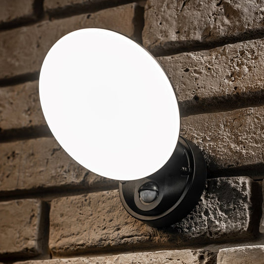 Our EZRA black plastic ABS plastic outdoor wall mounted round outdoor light with built in LED's would look perfect in a modern or more traditional home design. It is designed for durability and longevity with its robust material producing a fully weatherproof and water resistant light fitting. With built in PIR motion sensor