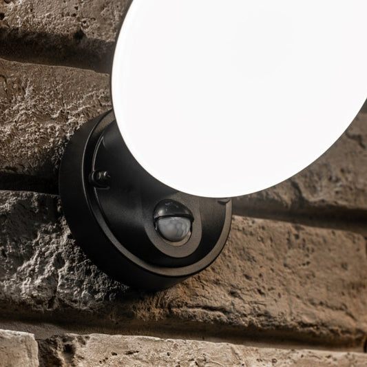 Our EZRA black plastic ABS plastic outdoor wall mounted round outdoor light with built in LED's would look perfect in a modern or more traditional home design. It is designed for durability and longevity with its robust material producing a fully weatherproof and water resistant light fitting. With built in PIR motion sensor