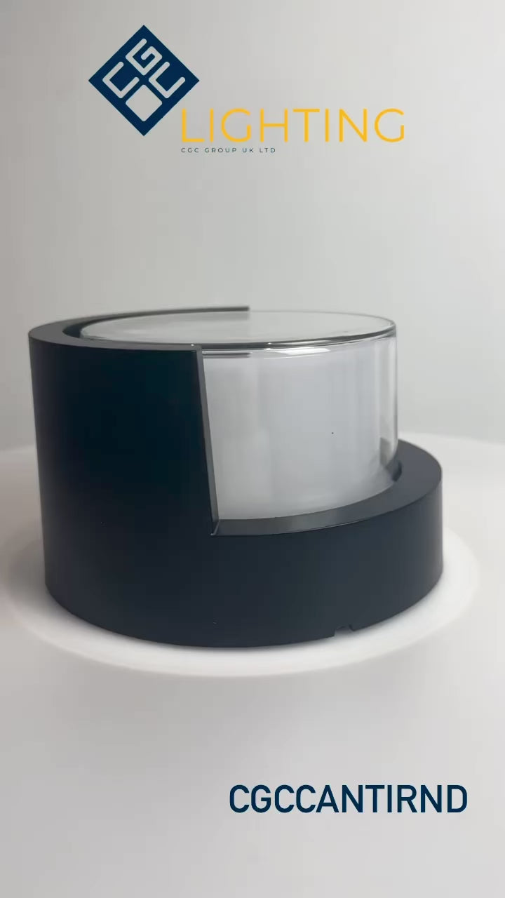 Load video: Sophia black and white round wall light is an modern simple fitting with a black polycarbonate body and opal diffuser. This stylish wall light is perfect for adding a pinch of modern flavour to doorways, sheds, patios, porch, driveways, garages, sheds, and more. This fitting is IP65 rated which makes it fully weatherproof light fitting.