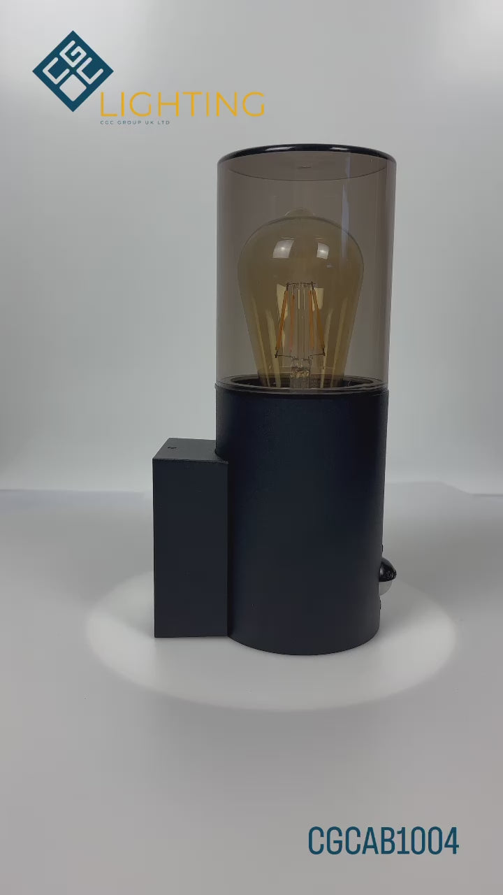 Load video: Explore our black cylinder wall light today, fit with a smoky diffuser and motion sensor features! If you require a valuable lighting system and an additional layer of security for your home’s outdoor space, then this lighting body can provide the right protection and style for you.