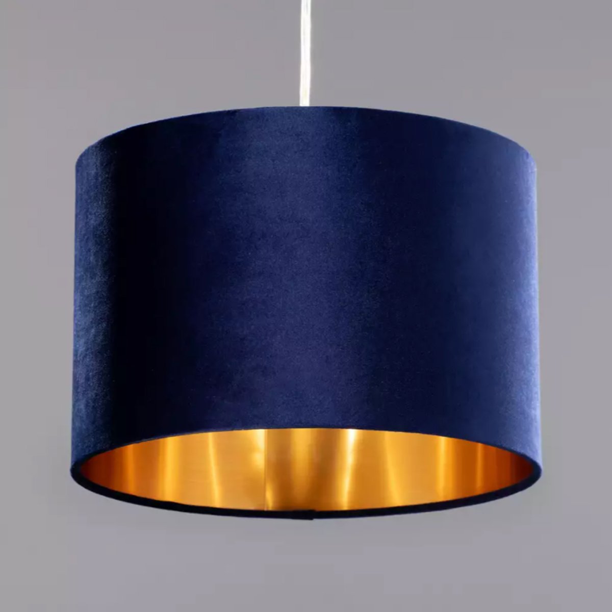Our Nila velvet shade is sophisticated in appearance and we have designed the shade to suit a range of interiors. Easy to fit, it’s crafted from high-quality velvet on the outer and has a reflective gold metallic inner. It's made to fit both a ceiling light or lamp base.