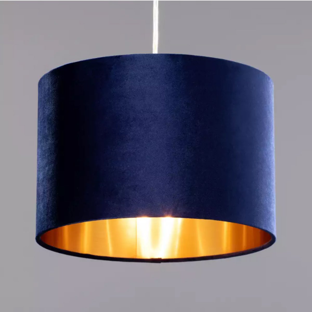 Our Nila velvet shade is sophisticated in appearance and we have designed the shade to suit a range of interiors. Easy to fit, it’s crafted from high-quality velvet on the outer and has a reflective gold metallic inner. It's made to fit both a ceiling light or lamp base.