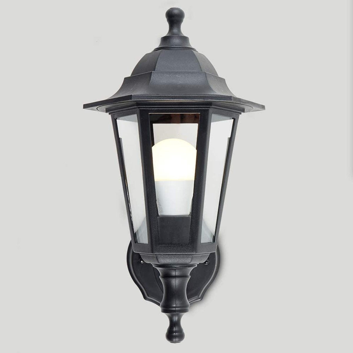 Our Orla black wall mounted traditional outdoor wall lantern light would look perfect in a modern or more traditional home design. Outside wall lights can provide atmospheric light in your garden, at the front door or on the terrace as well as a great security solution. It is designed for durability and longevity with its robust material producing a fully weatherproof and water resistant light fitting.