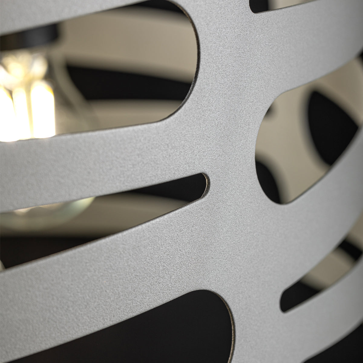 Our Marissa pendant ceiling Light is a strikingly beautiful fitting modern and contemporary in its appearance. This pendant light is constructed from a metal circular shade with laser cut outs and comes complete with a black adjustable cord and matching ceiling rose. When lit this light creates something spectacular as the light shines through the cut out shapes.
