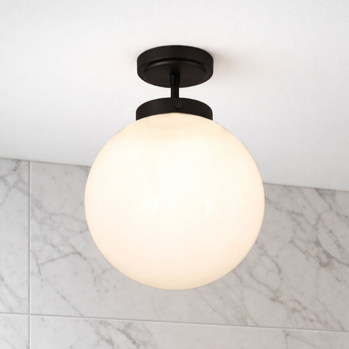 Modern grey bathroom with walk-in shower, freestanding bath and a white three-spot bathroom ceiling light.