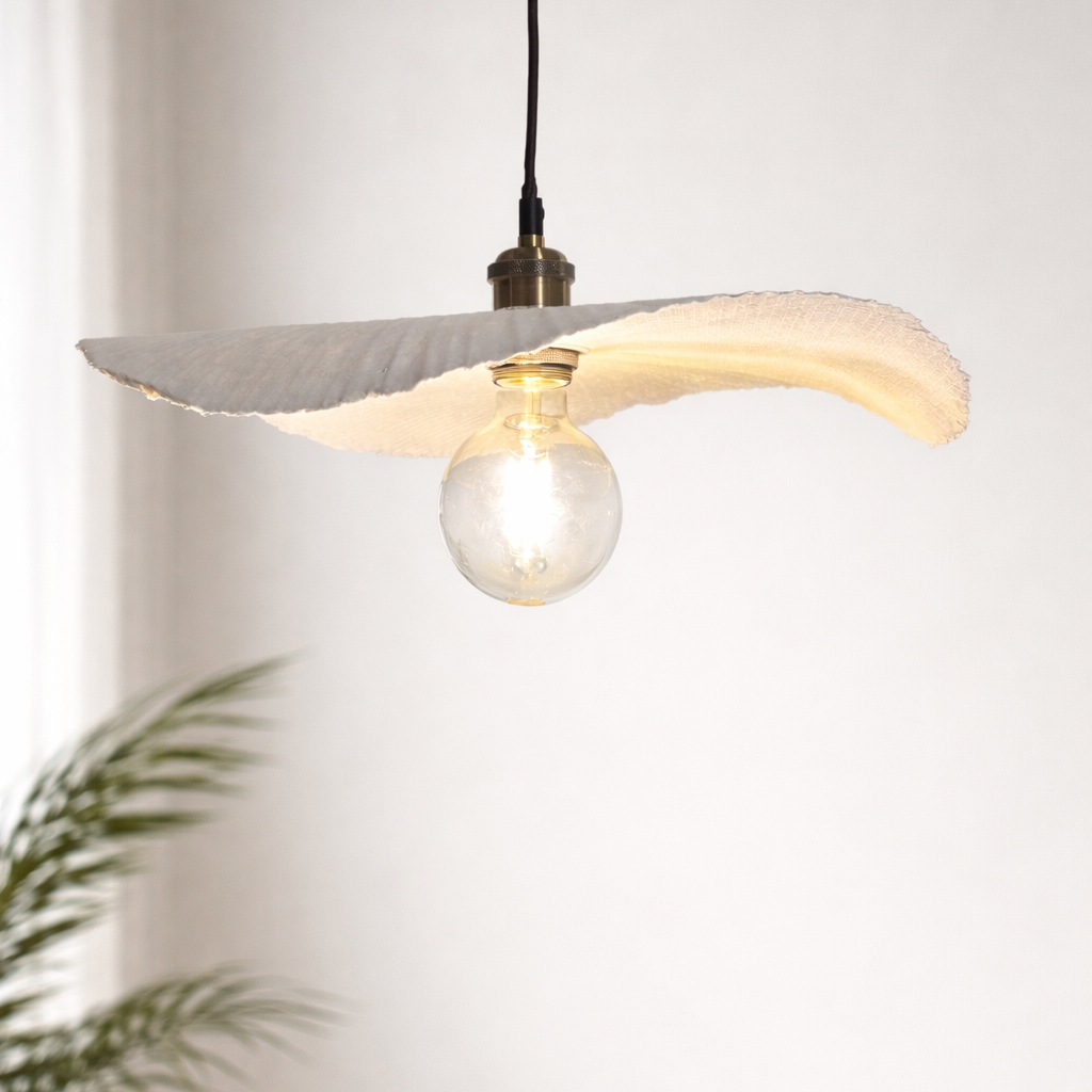 Modern pendant light with a unique design on a plain background