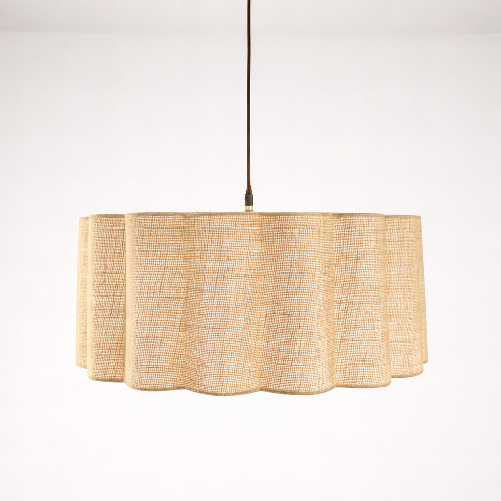 Pendant light with a natural woven shade on a white background