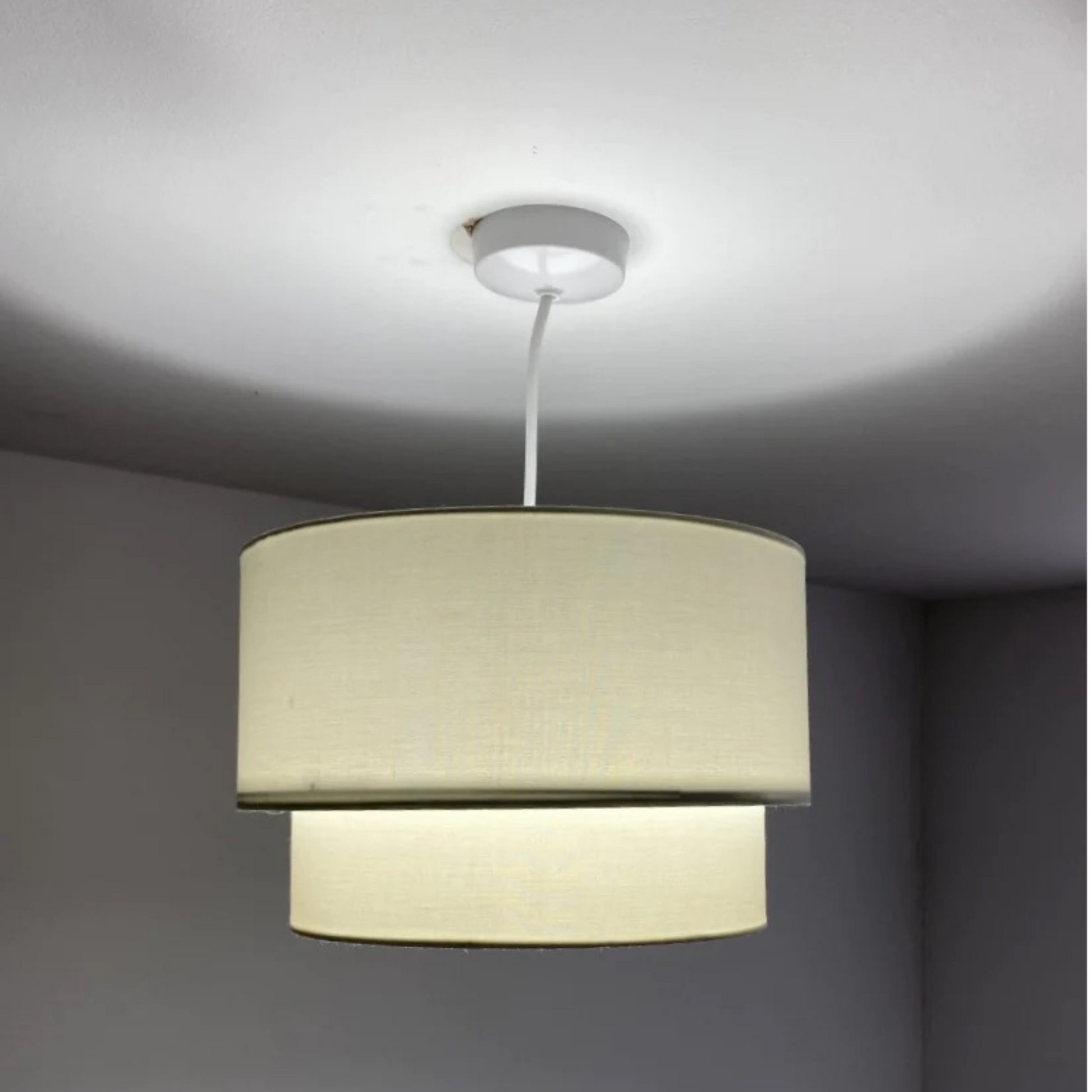 Our Kimber easy fit two tiered luxury fabric double layered shade is contemporary in its appearance and we have designed the shade to suit a range of interiors. Easy to fit simply attached to an existing pendant flitting.  It is crafted from high quality fabric material in two layers and complimented with a white inner