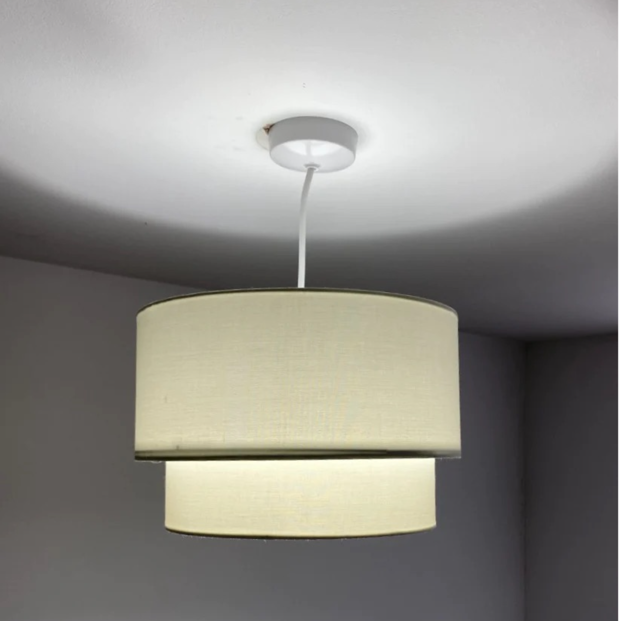 Our Kimber easy fit two tiered luxury fabric double layered shade is contemporary in its appearance and we have designed the shade to suit a range of interiors. Easy to fit simply attached to an existing pendant flitting.  It is crafted from high quality fabric material in two layers and complimented with a white inner