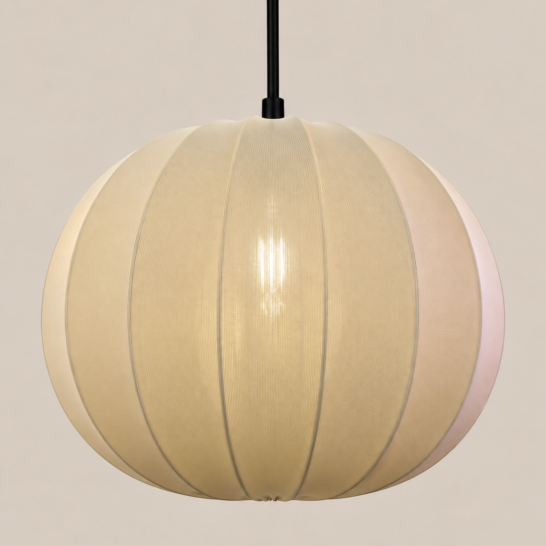 A spherical pendant light with a warm cream-colored ribbed shade, suspended by a black cord against a solid beige background.