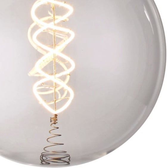 Our Large clear glass filament E27 LED Bulbs provide a unique aesthetic, blending seamlessly into many decors. Our anti-glare round globes give off a warm white light that creates a subtle ambiance for a vintage look. With low glare and maximum style, this energy-saving lamp is perfect for exposed lighting designs. 
