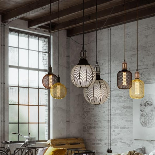 Our decorative black mesh E27 LED globe bulb provides a unique aesthetic, blending seamlessly into many decors. Made from black wire mesh in a cross hatch pattern giving this bulb a real industrial feel. This energy-saving bulb is perfect for exposed lighting designs fits any standard E27 lamp holder.