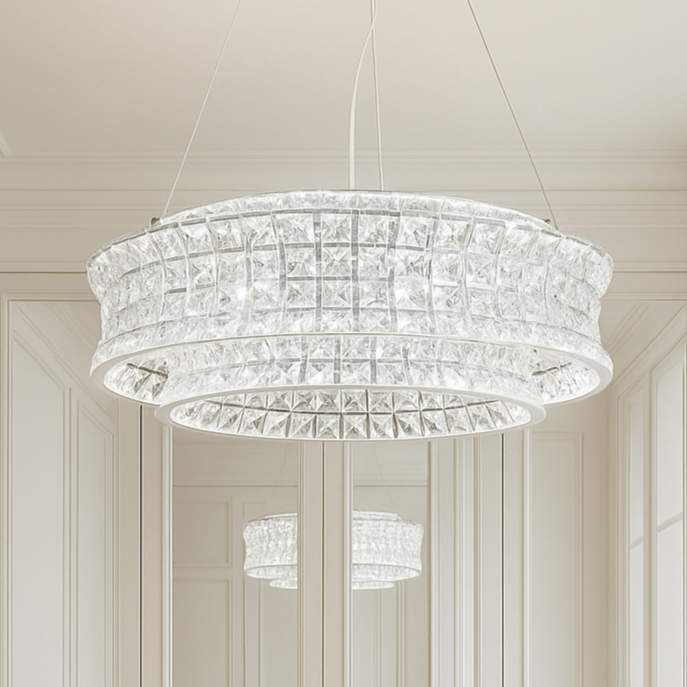 Modern interior with a chandelier, mirror, and desk in a well-lit room.