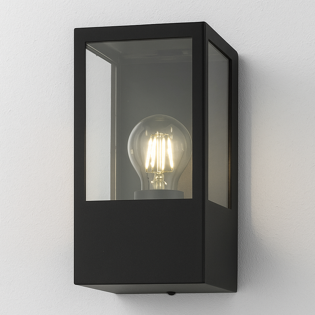 Black wall-mounted light fixture with a visible light bulb on a white background