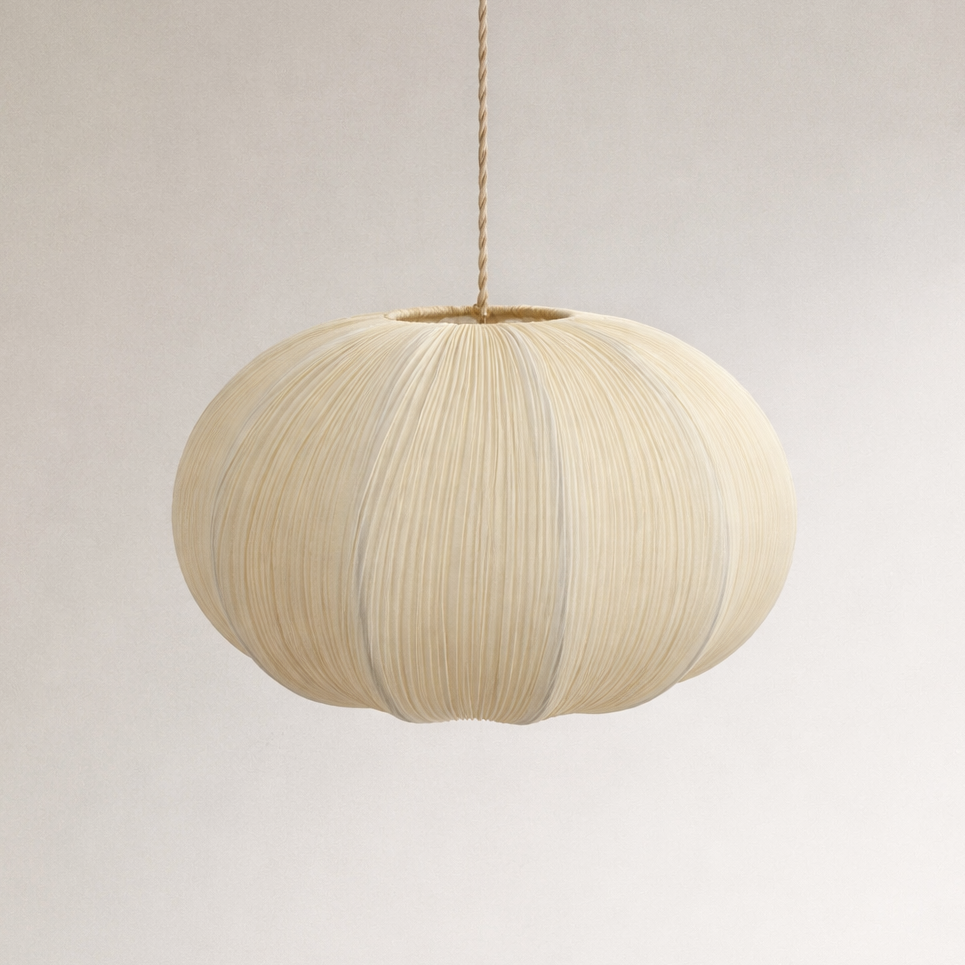 Beige pendant lamp with a textured surface on a plain background